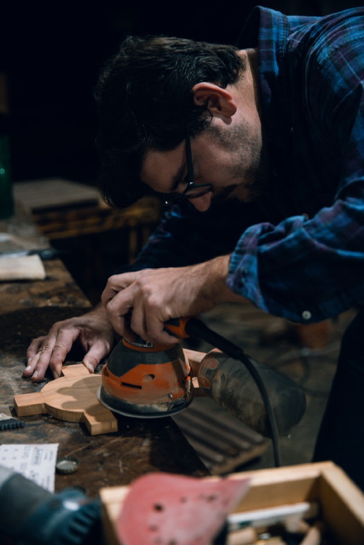 Milton Weis sanding in the workshop