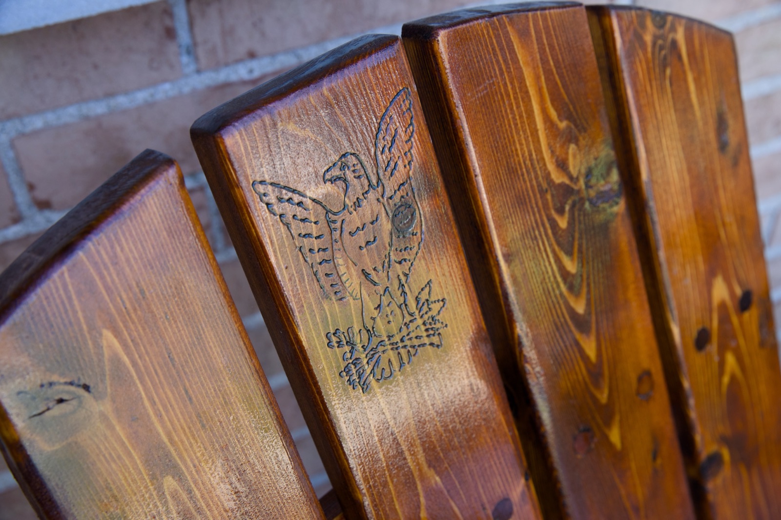 Adirondack chair with eagle engraving