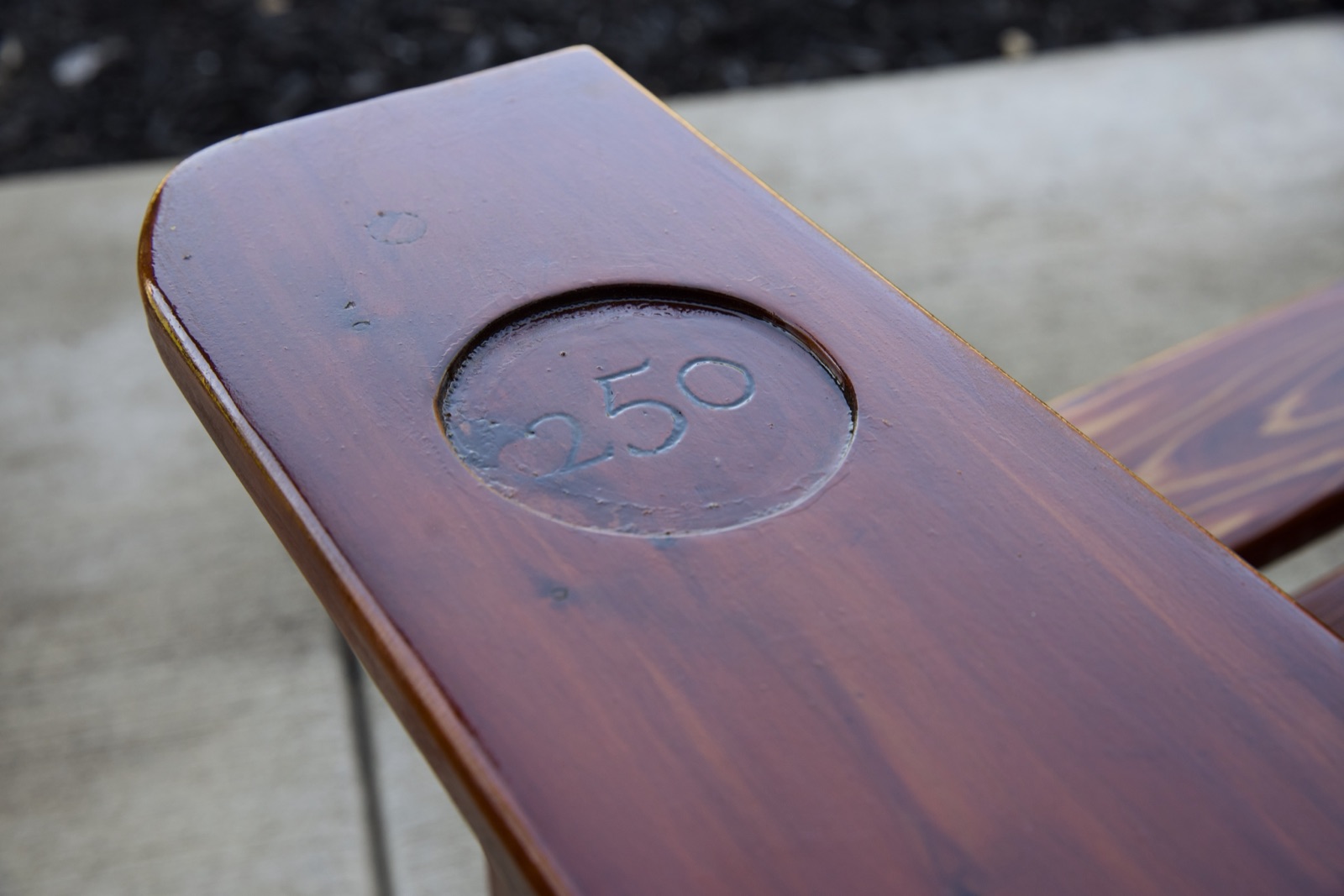 Adirondack chair with 250 engraving on the armrest cupholder