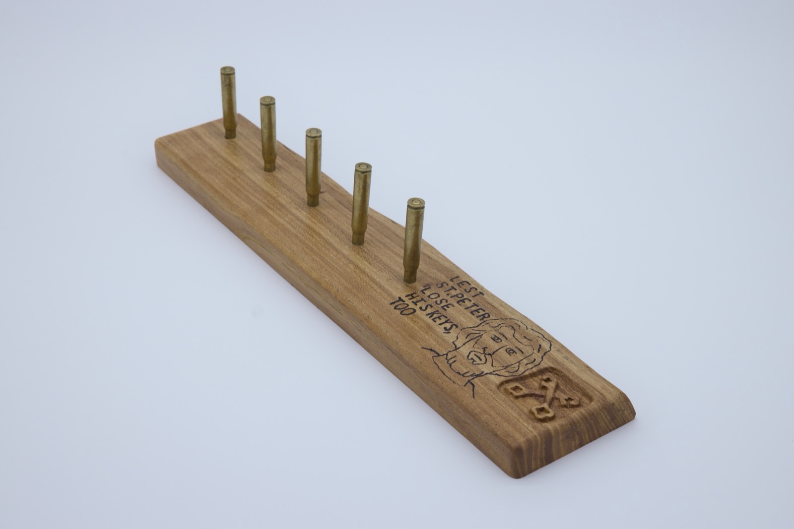 Bullet casing coat hanger